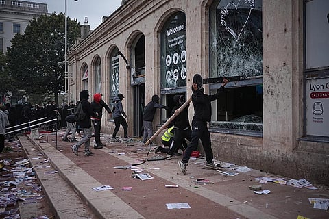 Protesters ransack a tourism office during a demonstration against rising living costs and in support of students' grievances in Lyon, France, Saturday, Oct. 17, 2026.