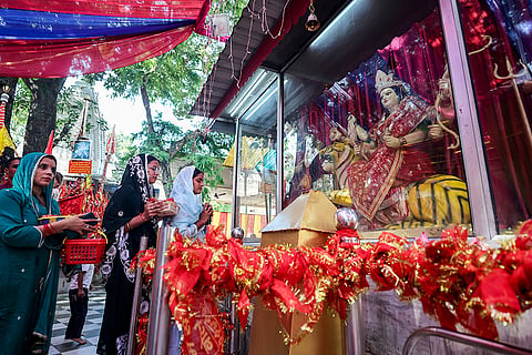 People offer prayers at Kol Kandoli Temple during the Navratri festival, at Nagrorta, in Jammu,
