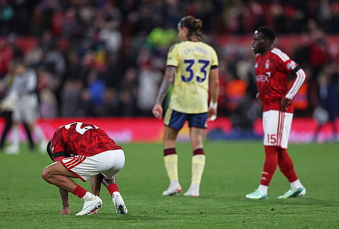Nottingham Forest's Daniel Munoz, left, reacts after the English Premier League soccer match between Nottingham Forest and Arsenal in Nottingham, England, Sunday, Oct. 18, 2026. 