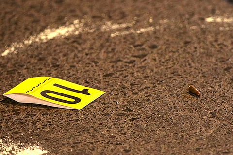 A bullet shell casing is encircled on a road amid an investigation conducted by the police and forensic officials at the crime scene where gunmen opened fire at Bollywood actor Tiger Shroff, near Pushpa Park under Juhu police station, in Mumbai, Maharashtra, Sunday, Oct. 18, 2026. The actor escaped unhurt while his driver and another driver of an autorickshaw were injured in the incident, police said.
