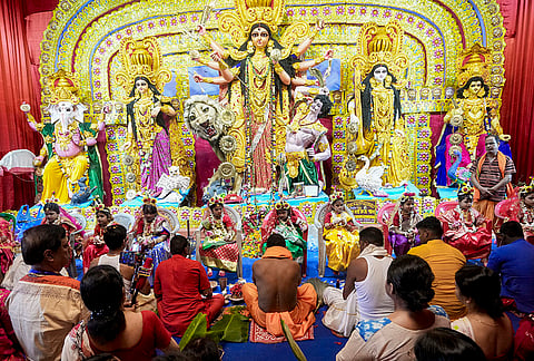 Priests perform rituals before young girls dressed as Goddess Durga during 'Kumari Puja' as part of Durga Puja festival celebrations, in Kolkata.

