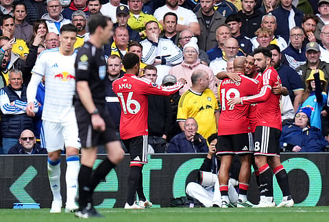 Manchester United's Bryan Mbeumo, third right, celebrates scoring during the English Premier League soccer match between Leeds United and Manchester United in Leeds, England, Sunday, Oct. 18, 2026. 
