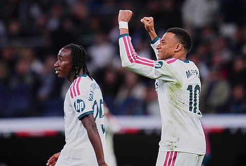 Real Madrid's Kylian Mbappe celebrates after scoring third goal during the La Liga soccer match between Real Madrid and Sevilla in Madrid, Spain, Sunday, Oct. 18, 2026. 