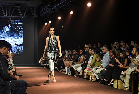 A model presents a creation by designer Suneet Varma during the Lakme Fashion Week x FDCI, in New Delhi, Thursday, Oct. 15, 2026. 
