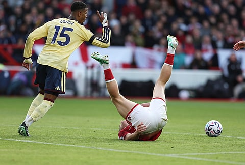 Arsenal's Ezri Konsa, left, and Nottingham Forest's Liam Delap in action during the English Premier League soccer match between Nottingham Forest and Arsenal in Nottingham, England, Sunday, Oct. 18, 2026. 