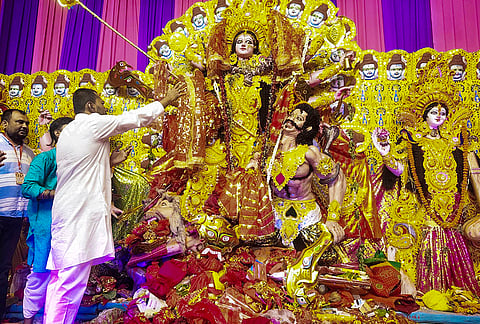 Bihar Health Minister Nishant Kumar offers prayers before Goddess Durga at a puja pandal during Navratri festival celebrations, in Patna.
