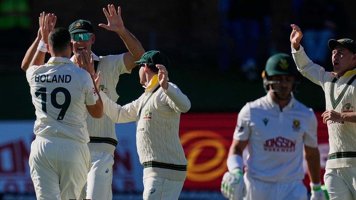 Australia's Scott Boland, left, celebrates the wicket of South Africa's Marques Ackerman on day two of the second cricket test match between South Africa and Australia, in Gqeberha, South Africa, Monday, Oct. 19, 2026 - (AP Photo/Themba Hadebe)