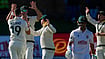 (AP Photo/Themba Hadebe) : Australia's Scott Boland, left, celebrates the wicket of South Africa's Marques Ackerman on day two of the second cricket test match between South Africa and Australia, in Gqeberha, South Africa, Monday, Oct. 19, 2026
