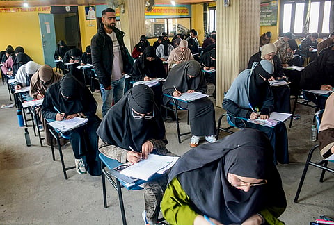 Students write their Class 10th annual Board examination at an examination centre, in Srinagar. Around one lakh students are appearing for the Class 10th examinations across Kashmir following the Jammu and Kashmir Government's decision to hold the annual exams in the October session. 
