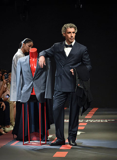 Actor Jim Sarbh walks the ramp showcasing an outfit by designer Ashish N Soni during the Lakme Fashion Week x FDCI, in New Delhi, Friday, Oct. 16, 2026. 
