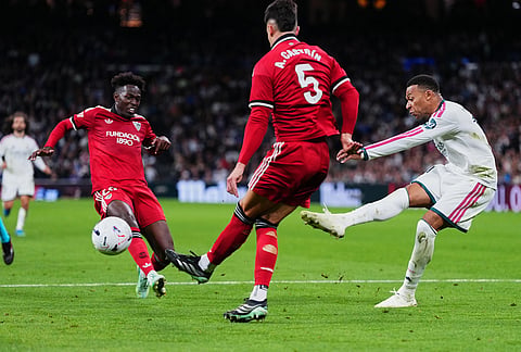 Real Madrid's Kylian Mbappe shoots during the La Liga soccer match between Real Madrid and Sevilla in Madrid, Spain, Sunday, Oct. 18, 2026. 