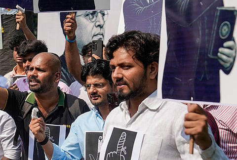 National Students' Union of India (NSUI) activists hold placards during the 'Ungli Toh Uthegi - Ravan Dahan' protest demanding the resignation of Chief Election Commissioner (CEC) Gyanesh Kumar, in New Delhi.
