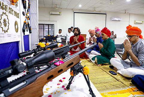 Rajkot Police Commissioner Brajesh Kumar Jha, second left, along with other officials perform a ritual during ‘Shastra Puja’ on 'Vijayadashami' (Dussehra), tenth day marking the conclusion of 'Navaratri' festival, at police headquarters, in Rajkot, Gujarat, Tuesday, Oct. 20, 2026. 
