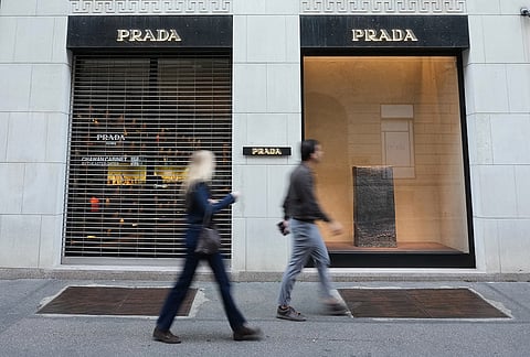 Luxury shops remain closed with windows emptied in Via Monte Napoleone street, in Milan, Italy, Monday, Oct. 19, 2026.