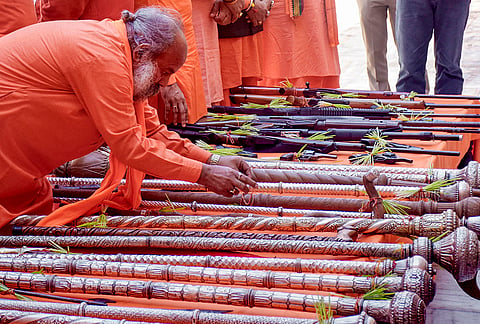 A seer performs a ritual during ‘Shastra Puja’ on 'Vijayadashami' (Dussehra), tenth day marking the conclusion of 'Navaratri' festival, at Shri Panchayati Akhada Mahanirvani, in Haridwar, Uttarakhand, Tuesday, Oct. 20, 2026. 
