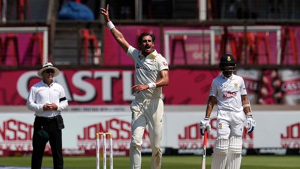 Australia's Mitchell Starc, center, celebrates taking a wicket on day five of the first cricket test match between South Africa and Australia, in Durban, South Africa, Tuesday, Oct. 13, 2026. - | Photo: AP/Themba Hadebe