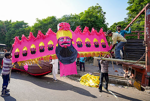Workers unload an effigy of demon king ‘Ravana’ for sale on the eve of the ‘Dussehra’ festival, in Amritsar, Monday, Oct. 19, 2026. 
