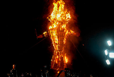 Flames erupt from an effigy installed by Indian Youth Congress (IYC) workers during a protest titled “Vote Chori Ki Raasleela”, at the IYC office in New Delhi, Monday, Oct. 19, 2026. 

