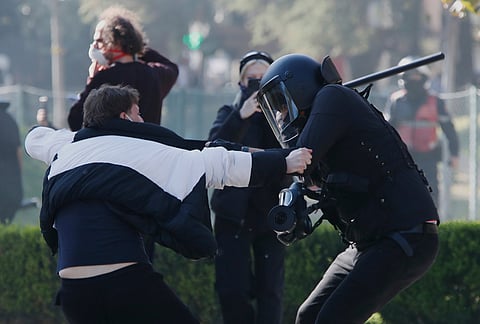 A riot police officer clashes with a protester during an anti-government demonstration in Tirana, Albania, Monday, Oct. 19, 2026. 
