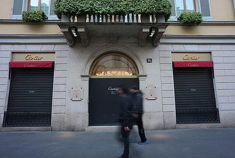 Luxury shops remain closed with windows emptied in Via Monte Napoleone street, in Milan, Italy, Monday, Oct. 19, 2026.
