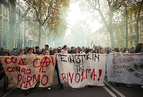 Student demonstrate under the slogan ''do like in France'', in Turin, Italy, Friday, Oct. 16, 2026. 
