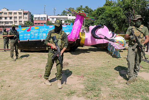 Special Operations Group (SOG) personnel conduct security checks near an effigy of demon king Ravana ahead of the Dussehra festival, in Jammu, Monday, Oct. 19, 2026. 
