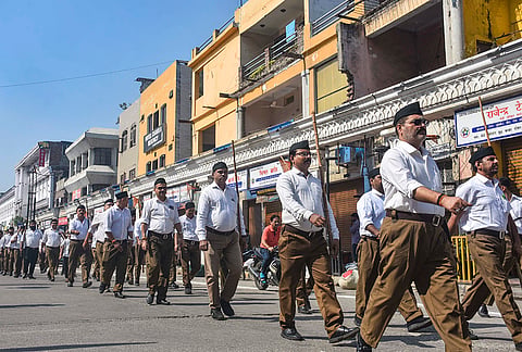 RSS volunteers take part in a march on ‘Dussehra’, in Moradabad, Uttar Pradesh.
