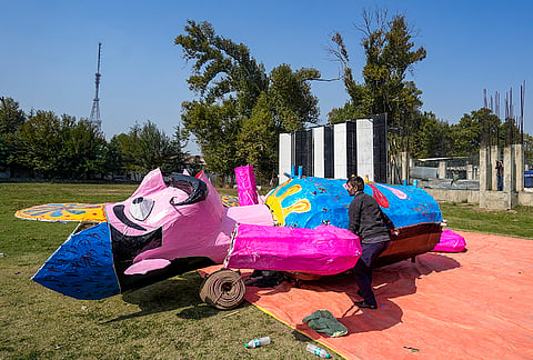 An artisan gives finishing touches to an effigy of demon king Ravana ahead of the Dussehra festival, in Srinagar, Monday, Oct. 19, 2026. 
