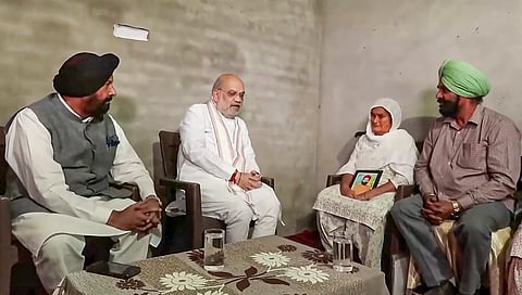 Union Home Minister Amit Shah meets the family members of late Vikramjit Singh, who allegedly lost his life after raising his voice against synthetic drug traders, in Gurdaspur, Punjab. 