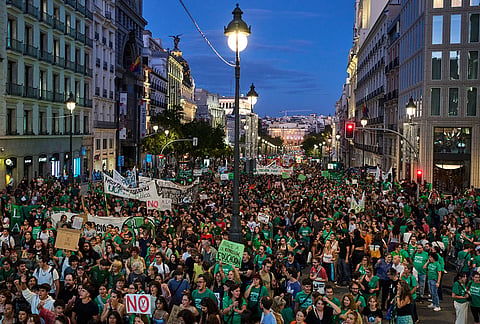 People march to demand more funding for public education during a protest in Madrid, Spain, Wednesday, Oct. 14, 2026. 
