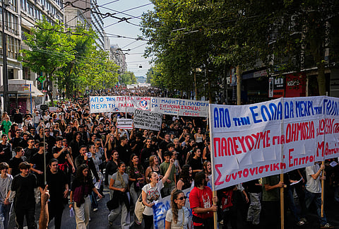 Protesters take part in a rally organized by teachers and students demanding improvements to education and measures to address the rising cost of living in Athens, Greece, Wednesday, Oct. 21, 2026. 
