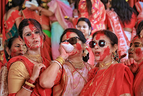 Women celebrate during 'Sindoor Khela', tradition of playing with vermilion, on 'Vijaya Dashami', last day of Durga Puja festival, at Durga Bari, in Jaipur, Rajasthan, Tuesday, Oct. 20, 2026. 
