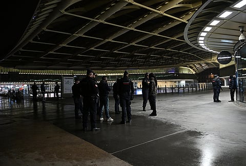 Policemen patrol during an overnight curfew in Paris, Tuesday, Oct. 20, 2026. 
