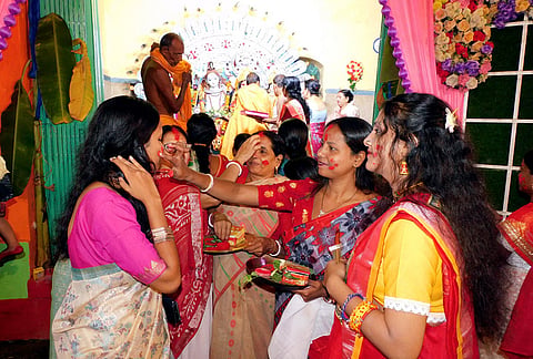 Women participate in the 'Sindoor Khela' ritual a day after 'Vijaya Dashami' celebrations, in Bankura, West Bengal, Wednesday, Oct. 21, 2026. 
