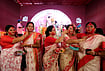 | Photo: PTI  : Women participate in the 'Sindoor Khela' ritual a day after 'Vijaya Dashami' celebrations, near Prayagraj, Uttar Pradesh, Wednesday, Oct. 21, 2026. 
