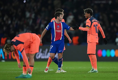 Barcelona's Lamine Yamal, greets PSG's Joao Neves at the end of the Champions League opening phase soccer match between Paris Saint-Germain and FC Barcelona in Paris, Tuesday, Oct. 20, 2026. 