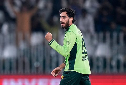 Pakistan's Arafat Minhas celebrates after taking the wicket of England's Jordan Cox during the tri-series one-day international cricket match between Pakistan and England, in Rawalpindi, Pakistan, Tuesday, Oct. 20, 2026. 