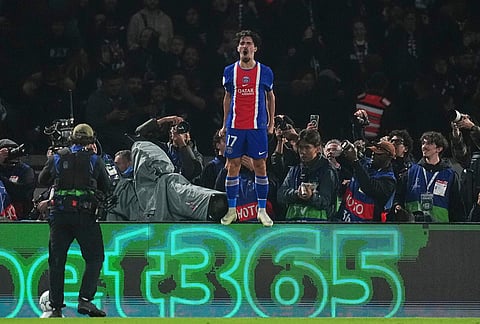 PSG's Vitinha celebrates after scoring his side's third goal during the Champions League opening phase soccer match between Paris Saint-Germain and FC Barcelona in Paris, Tuesday, Oct. 20, 2026. 