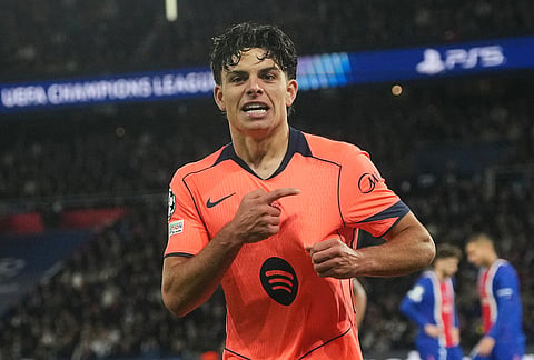 Barcelona's Xavi Espart celebrates after scoring his side's opening goal during the Champions League opening phase soccer match between Paris Saint-Germain and FC Barcelona in Paris, Tuesday, Oct. 20, 2026. 