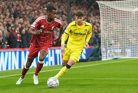 Liverpool's Alexander Isak, left, challenges for the ball with Villarreal's Pau Navarro during the Champions League opening phase soccer match between Liverpool and Villarreal in Liverpool, England, Tuesday, Oct. 20, 2026. 