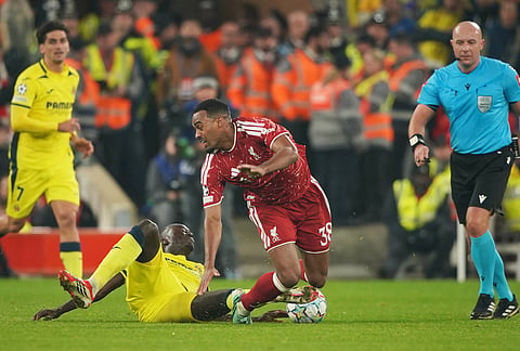 Villarreal's Pape Gueye, bottom, challenges for the ball with Liverpool's Ryan Gravenberch during the Champions League opening phase soccer match between Liverpool and Villarreal in Liverpool, England, Tuesday, Oct. 20, 2026. 