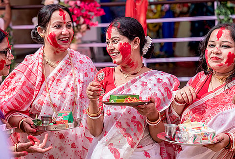 Women celebrate during 'Sindoor Khela', tradition of playing with vermilion, on 'Vijaya Dashami', last day of Durga Puja festival, at Durgabari Samiti, in Jodhpur, Rajasthan, Tuesday, Oct. 20, 2026. 
