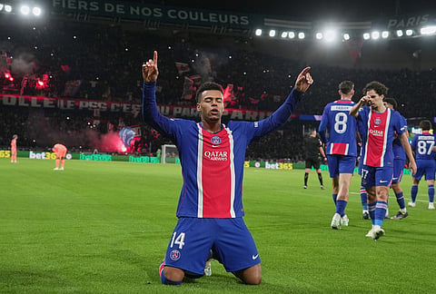 PSG's Desire Doue celebrates after scoring his side's opening goal during the Champions League opening phase soccer match between Paris Saint-Germain and FC Barcelona in Paris, Tuesday, Oct. 20, 2026. 

