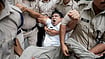 | Photo: PTI/Ravi Choudhary : Police personnel detain Indian Youth Congress (IYC) National President Uday Bhanu Chib during a protest