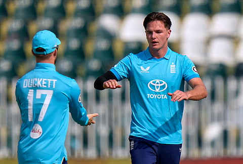 England's Sonny Baker, right, celebrates with teammate after taking the wicket of Pakistan's Saim Ayub during the tri-series one-day international cricket match between Pakistan and England, in Rawalpindi, Pakistan, Tuesday, Oct. 20, 2026. 
