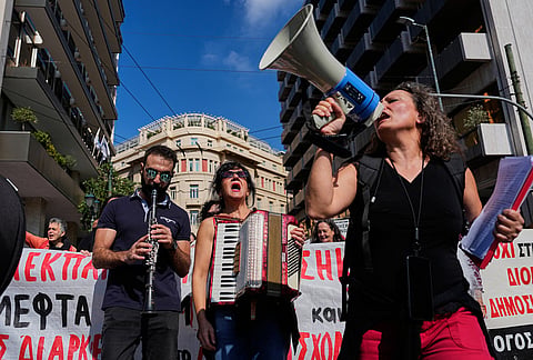 Protesters take part in a rally organized by teachers and students demanding improvements to education and measures to address the rising cost of living in Athens, Greece, Wednesday, Oct. 21, 2026. 
