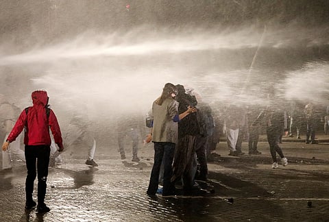 A police water cannon sprays demonstrators at an anti-government protest in Tirana, Albania, late Tuesday, Oct. 20, 2026. 