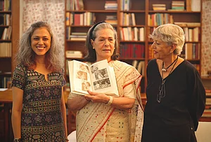 | Photo: AICC via PTI : Congress Parliamentary Party Chairperson (CPP) and MP Sonia Gandhi, centre, during the unveiling of her upcoming book 'Belonging: A Journey of Love', as she makes her debut on Instagram, in New Delhi.