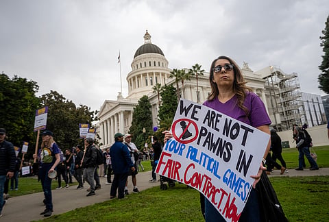 Members of SEIU Local 1000 stage in front of the state capitol during a one-day strike on Wednesday, Oct. 21, 2026, in Sacramento, California. 
