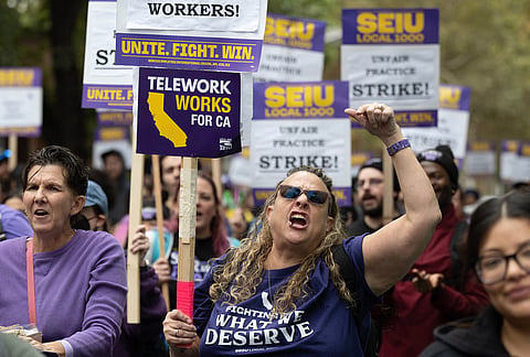 Members of SEIU Local 1000 march during a one-day strike on Wednesday, Oct. 21, 2026, in Sacramento, California. 